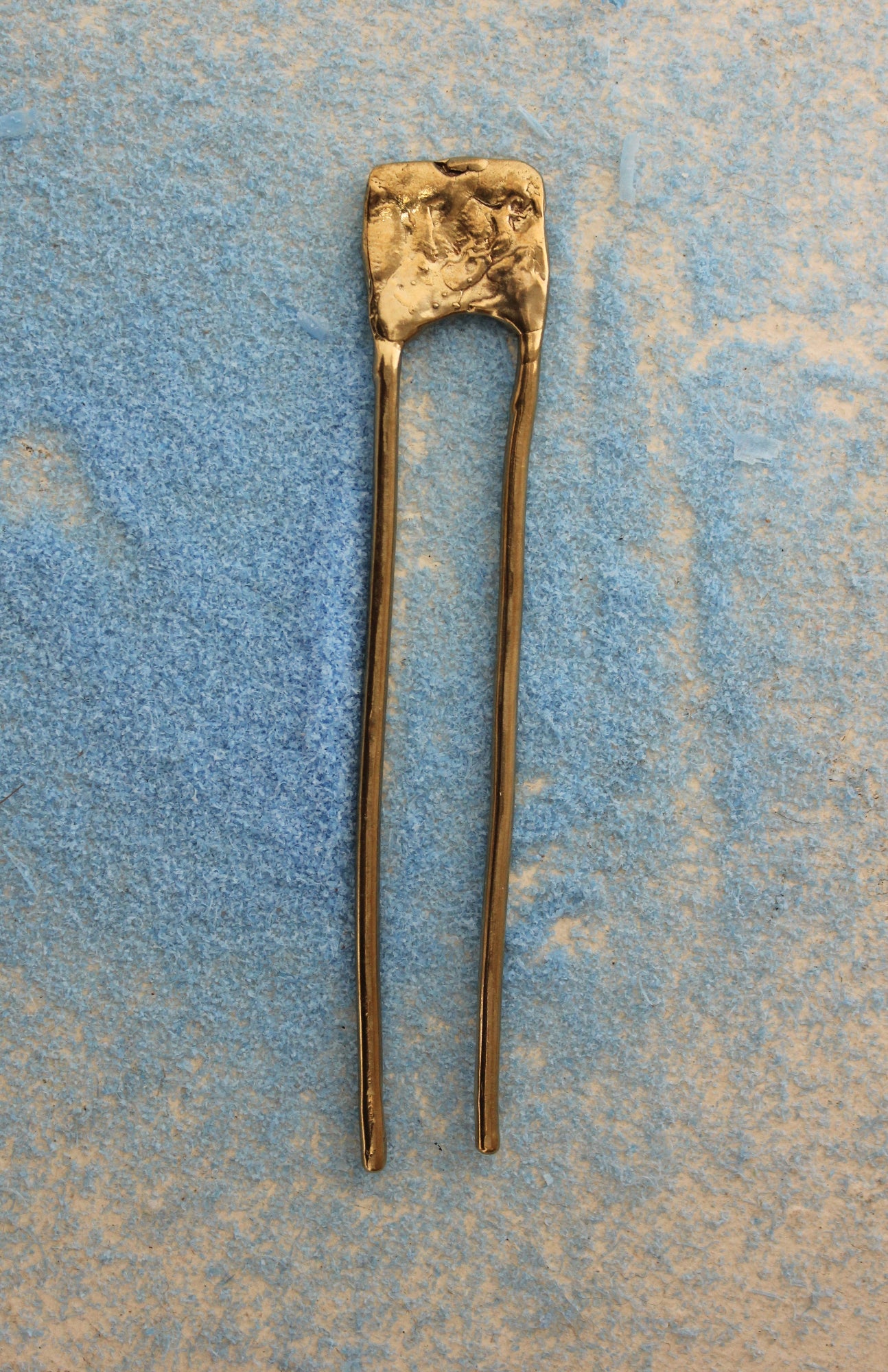Hand sculpted solid brass hair pin.