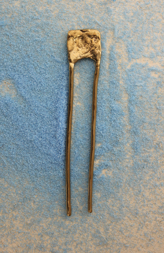 Hand sculpted solid brass hair pin.