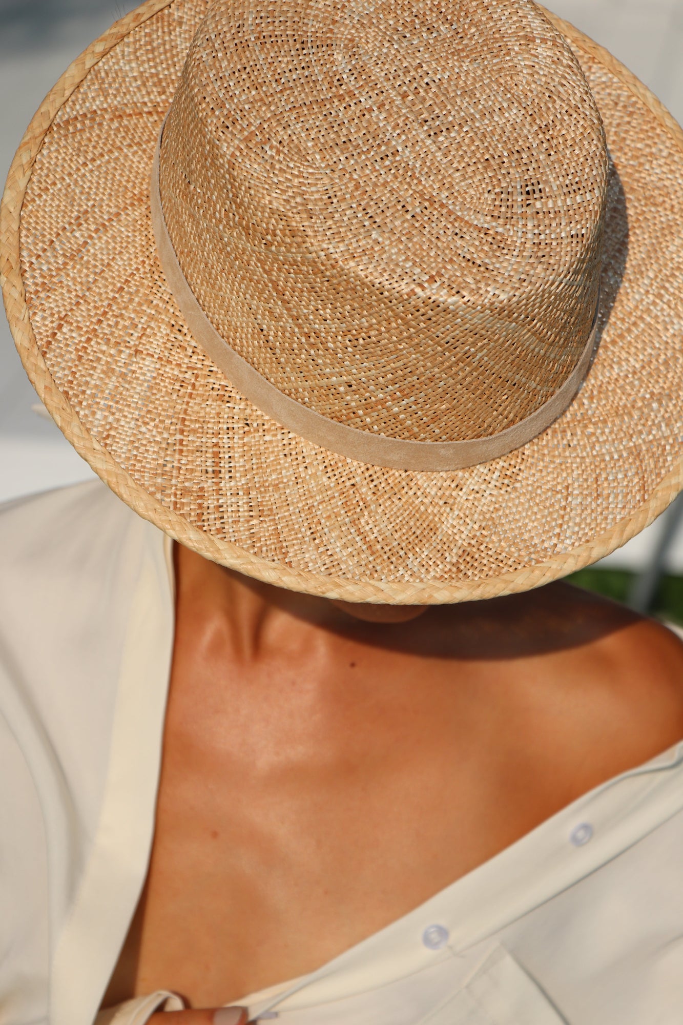 Close-up of a straw hat with a blurred background